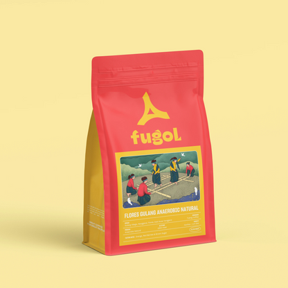 A red stand-up pouch of Fugol Flores Oligo Anacahua Natural coffee, featuring a yellow logo and a colorful illustration on the front, set against a solid pale yellow background.