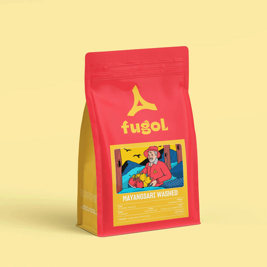A red stand-up pouch of Fugol Mayangsari Washed coffee, featuring a yellow logo and a colorful illustration on the front, set against a solid pale yellow background.